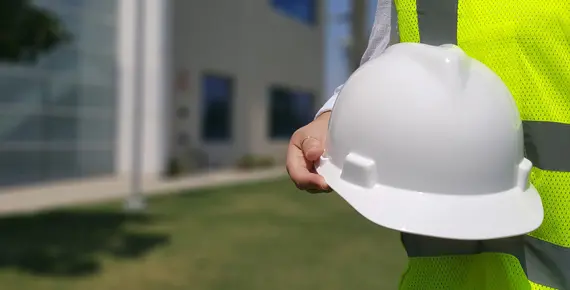 Employee holding a hard hat