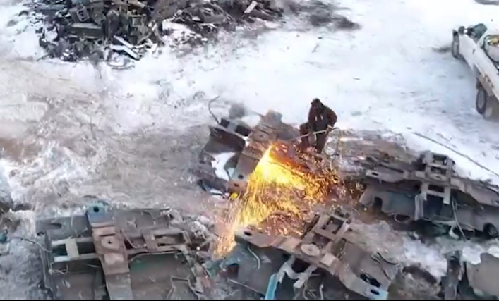 Drone shot of one of PFL's Mobile Scrapping Team cutting the remains of a railcar.